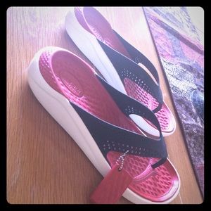 Lite Ride Flips from Crocs.  Size 10 has roomy fit